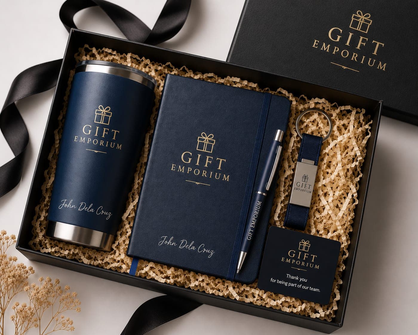 Premium navy corporate gift set — tumbler, journal, pen and keychain branded by Gift Emporium